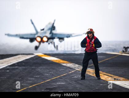 PACIFIC OCEAN (Nov. 28, 2016) Petty Officer 2nd Class Mickey Waldron, assigned to the aircraft carrier USS Nimitz (CVN 68), stands near the safe shot