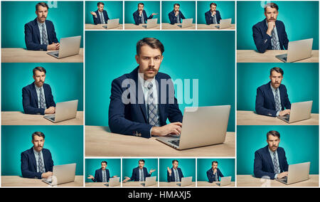 Sad Young Man Working On computer At Desk Stock Photo