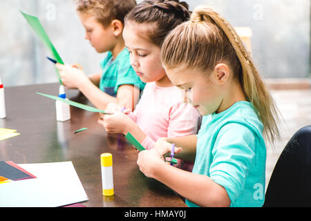 Schoolchildren making applique Stock Photo