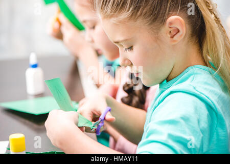 Schoolchildren making applique Stock Photo