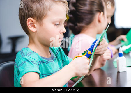 Schoolchildren making applique Stock Photo