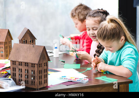 Schoolchildren making applique Stock Photo