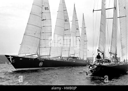 AJAXNETPHOTO. 6TH JUNE,1976. PLYMOUTH, ENGLAND. - OSTAR 1976 - THE HUGE 236FT CLUB MEDITERRANEE SKIPPERED BY ALAIN COLAS MANOUEVERS TOWARD THE START LINE. OVERALL WINNER ERIC TABARLY IN PEN DUICK VI SAILS PAST ON THE RIGHT.   PHOTO:JONATHAN EASTLAND/AJAX REF:2760506 13 Stock Photo