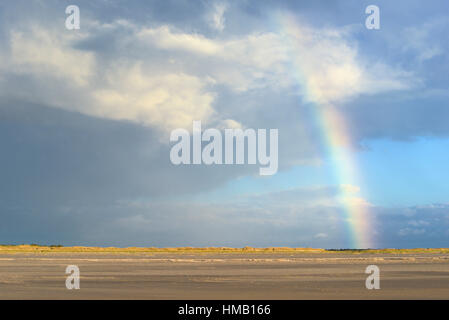 Rainbow over dunes, Sankt Peter-Ording, Schleswig-Holstein Wadden Sea National Park, North Frisia, Schleswig-Holstein, Germany Stock Photo