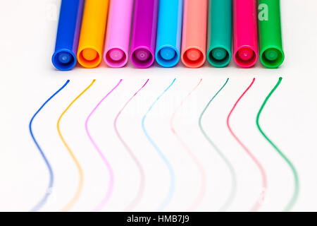 A close up image of caps of markers by their matching colored line. Stock Photo