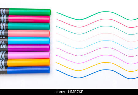 A close up image of caps of markers by their matching colored line. Stock Photo