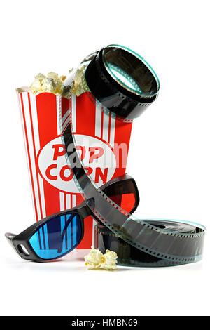 popcorn in a cardboard container with filmstrip and anaglyph glasses isolated on white background Stock Photo