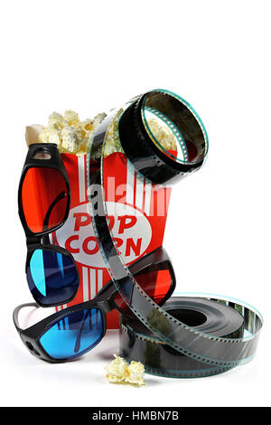 popcorn in a cardboard container with filmstrip and anaglyph glasses isolated on white background Stock Photo