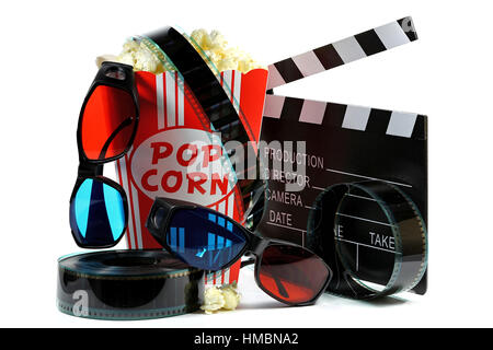 popcorn in a cardboard container with clapperboard, filmstrip and anaglyph glasses isolated on white background Stock Photo