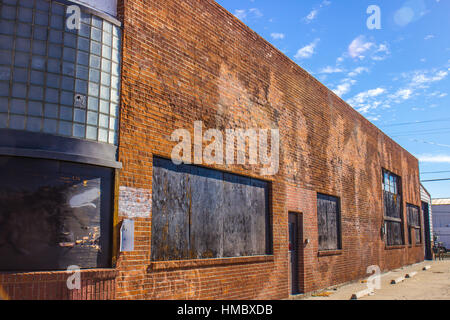 Old Used Boarded Up Brick Building Side Stock Photo