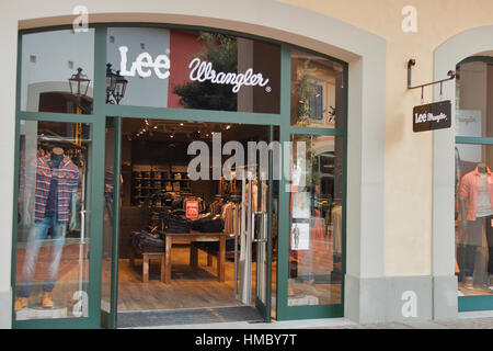 MUGELLO, ITALY - SEPTEMBER 11, 2014: Facade of Lee Wrangler store in McArthurGlen Designer Outlet Barberino. Wrangler is an American manufacturer of j Stock Photo