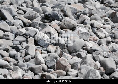 Full frame view of dry rocks and pebbles on Australian beach Stock Photo