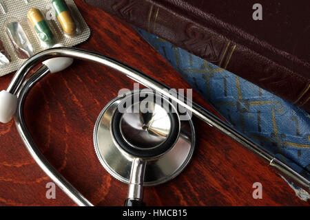 Stethoscope and books on a table. Medical education. Stock Photo