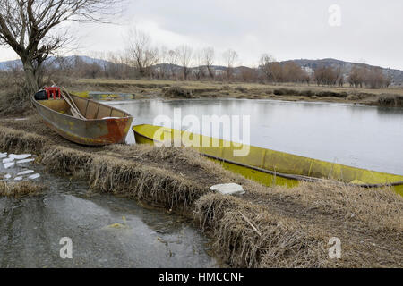 Old fishings boat on the shore of the lake Stock Photo - Alamy