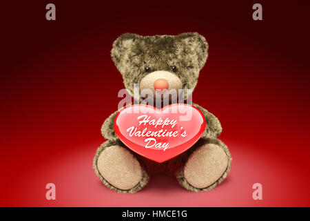 Cute fury teddy bear holding red heart. 3D illustration Stock Photo