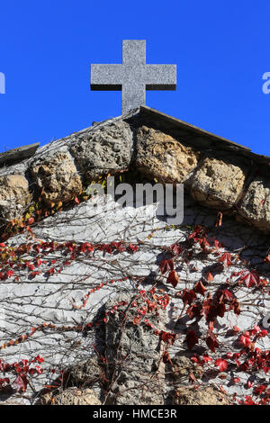 Croix en pierre. Entrée du cimetière. Cemetery Contamines-Montjoie. Stock Photo