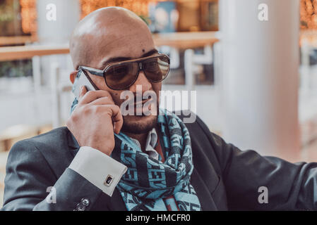 Arab businessman talking on mobile phone Stock Photo