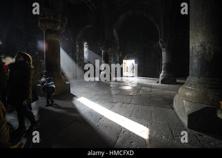 Dark interior of Geghard monastery in Armenia in Winter Stock Photo