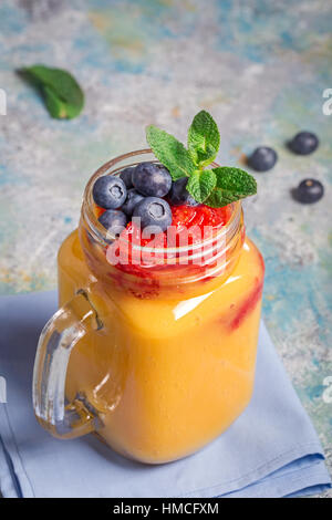 Mango drink and blueberries closeup Stock Photo