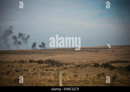 Smoke from tank and star shells on impact area, Salisbury Plain Training Area, Wiltshire. Stock Photo