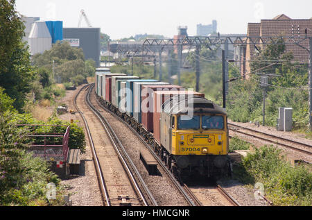 A class 57 locomotive working a Freigthliner approaches Caledonian Road & Barnsbury on the North London Line. 12th July 2006. Stock Photo