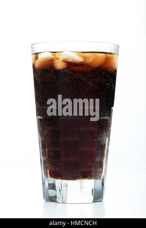 glass with brown soda and ice isolated on white Stock Photo