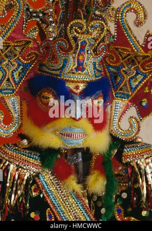 Multicoloured carnival mask decorated with feathers and sequins, Port-of-Spain, Trinidad and Tobago. Stock Photo