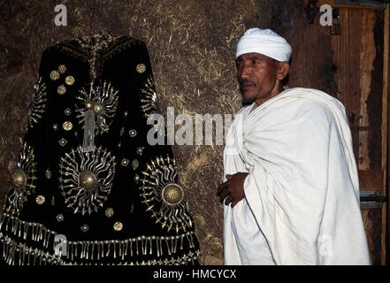 Priest with ceremonial vestments, Ura Kidane Mihret, Lake Tana, Ethiopia. Stock Photo