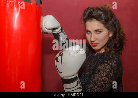 Lovely girl on training in boxing. Stock Photo