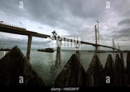 The final deck piece of the Queensferry Crossing over the Firth of Forth, sits on a barge ahead of it being lifted into position. Once the operation to start the lift begins, it will take around four hours to complete. Stock Photo