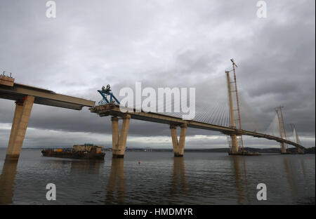 The final deck piece of the Queensferry Crossing over the Firth of Forth, sits on a barge ahead of it being lifted into position. Once the operation to start the lift begins, it will take around four hours to complete. Stock Photo