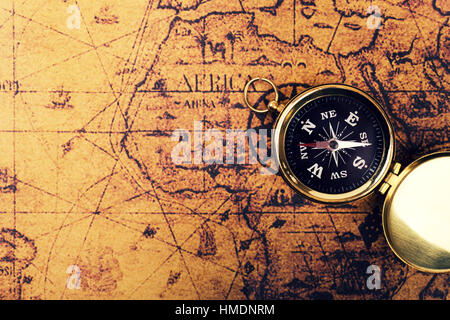 compass on old vintage world map with copy space Stock Photo
