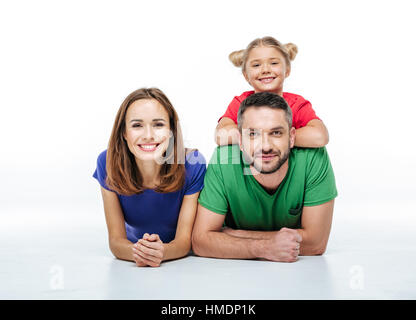 Smiling parents with cute little daughter Stock Photo