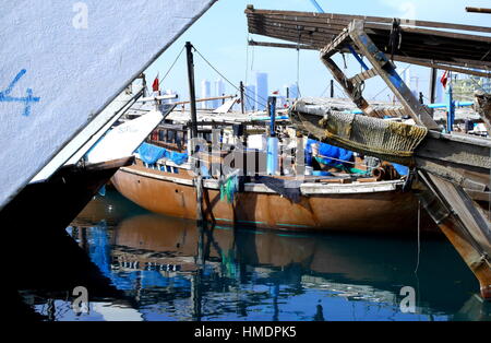 Fishing dhows in the dhow harbour, Seef District in the distance, Manama, Kingdom of Bahrain Stock Photo