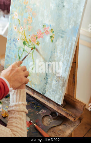 Close up of mans and womans hands painting together Stock Photo