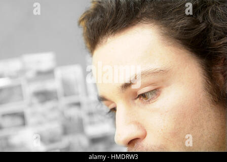 Young man with pensive gaze Stock Photo