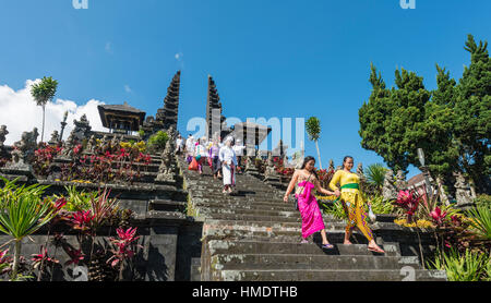 Devout Balinese descend stairs, split gate, Candi bentar, mother temple Besakih, Pura Agung Besakih Penetaran, Banjar Besakih Stock Photo