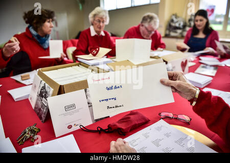 EDITORS NOTE IMAGE PIXELATED BY PA PICTURE DESK A handwriting test card is held up as online messages are written into Valentines day cards in the pop-up post office in the village of Lover, New Forest, where residents have launched a Valentine's Day post service, allowing romantics around the world to send a card from the Wiltshire village. Stock Photo