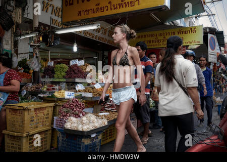 Inappropriately attired and Scantily dressed woman street shopping. Thailand Southeast Asia Stock Photo