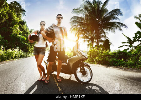 Couple man woman motorcycle sunset road Stock Photo