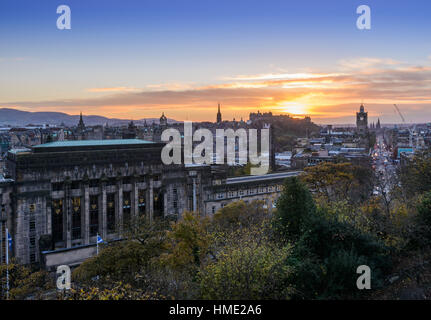 Edinburgh skyline with the Edinburgh castle in the background viewed from Calton Hill during last moments of sunset. Stock Photo