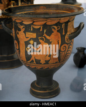 Red-figure bell krater. At the centre, a young man looking himself in a mirror, flanked by two women wearing cloaks. From Cumae. Attributed to the APZ painter, ca.320 BC. Cumana Section. Archaeological Museum. Naples. Italy. Stock Photo