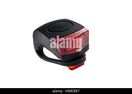 Detachable bicycle safety red blinking tail LED light. Rubber black and red LED bike light with power switch with removable strap. Stock Photo