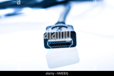 Black audio video HDMI computer cable isolated on white background. Close up of home entertainment connection cable for sound and video. Stock Photo