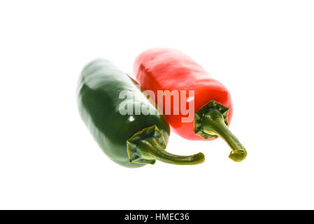 Red and green ripe jalapeno chili hot pepper from caribbean or mexico isolated on white background Stock Photo