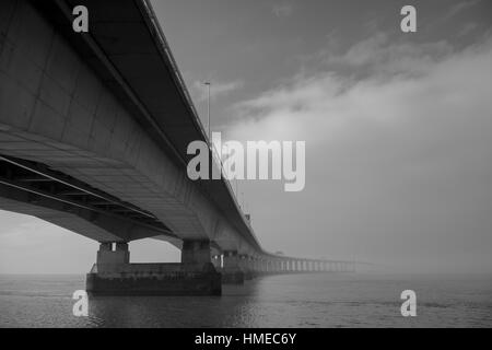 Across the Severn second road crossing from Severn Beach to Wales on a foggy, Winter morning. Stock Photo