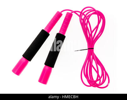 Pink jump rope or skipping rope isolated on white background. Sports, fitness, cardio, martial art and boxing accessories. Stock Photo
