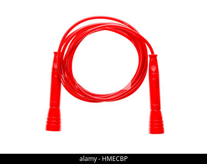 Red jump rope or skipping rope isolated on white background. Sports, fitness, cardio, martial art and boxing accessories. Stock Photo