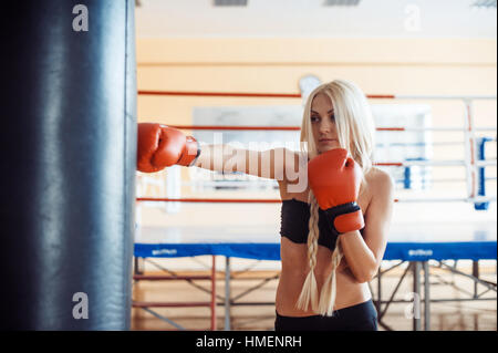 Pretty sport woman with boxing gloves Stock Photo