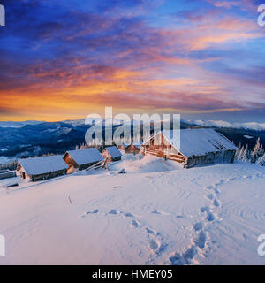 cottage in snowy mountains Stock Photo